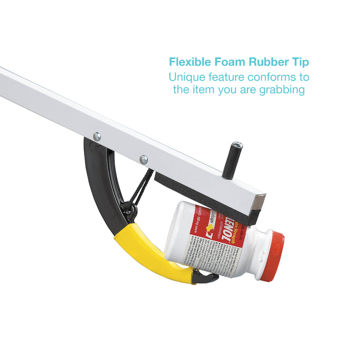 A white and black grabber tool holding a white bottle with a red cap, with a yellow flexible foam rubber tip. Blue text on the right reads 'Flexible Foam Rubber Tip' and 'Unique feature conforms to the item you are grabbing'.