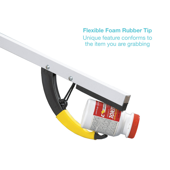 A white and black grabber tool with a yellow curved foam rubber tip holding a white bottle with a red cap, on a white background with blue text explaining the flexible foam rubber tip feature.