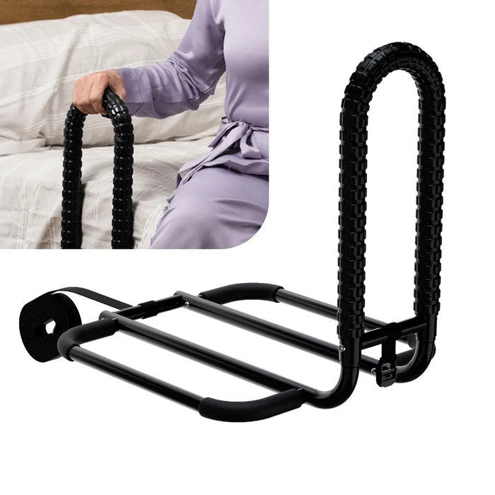 Black bed rail with a person using it on a bed