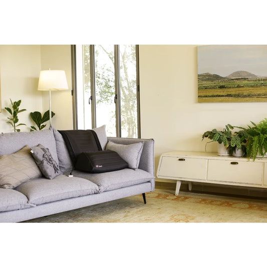 Gray sofa with a black SitnStand in a living room setting