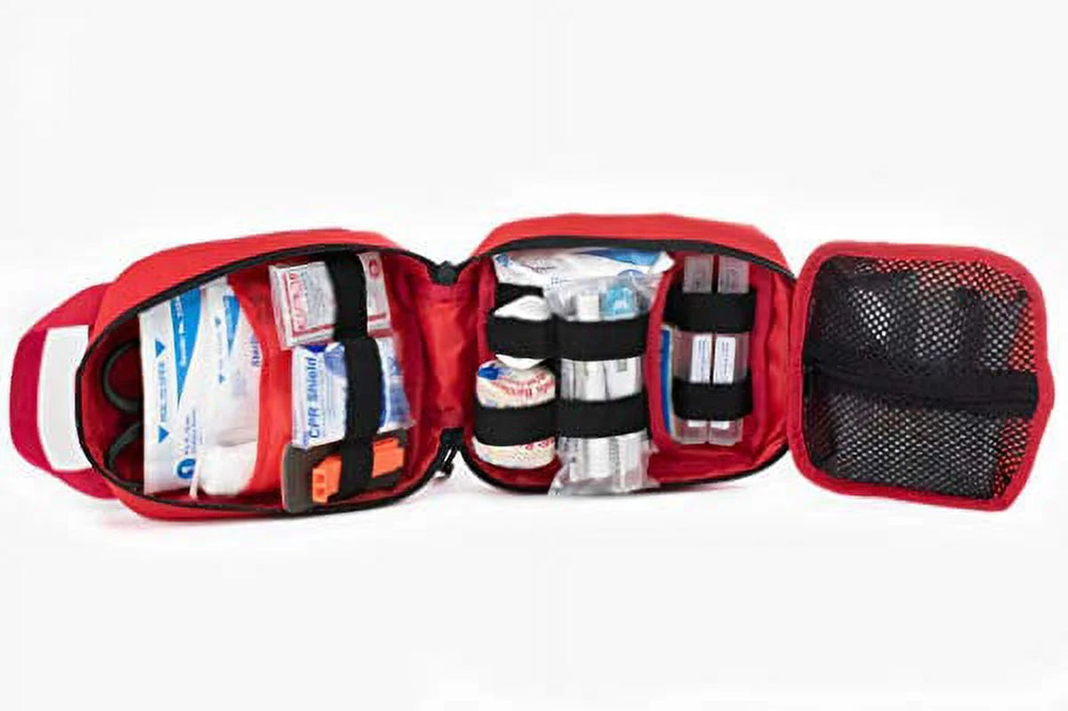 Red first aid kit with open compartments on a white background

