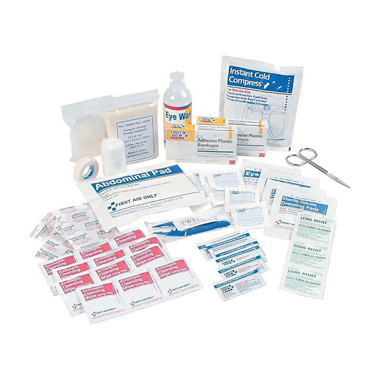 Collection of first aid supplies including bandages, ointments, and a bottle on a white background

