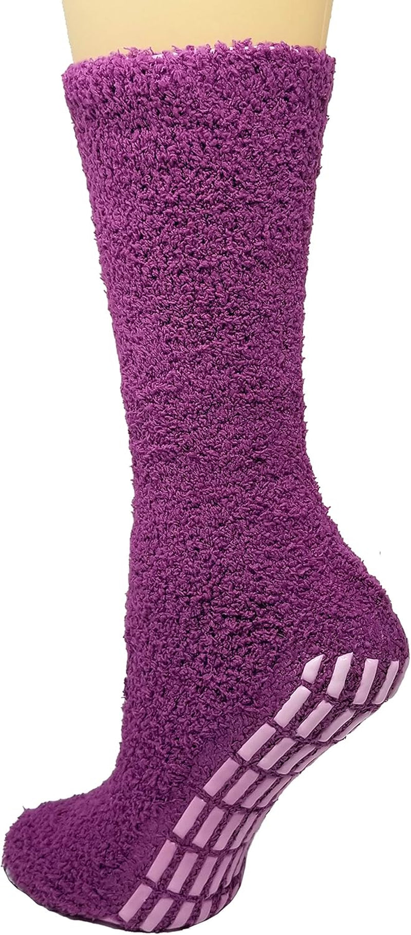 Purple fuzzy sock with non-slip sole on a neutral background