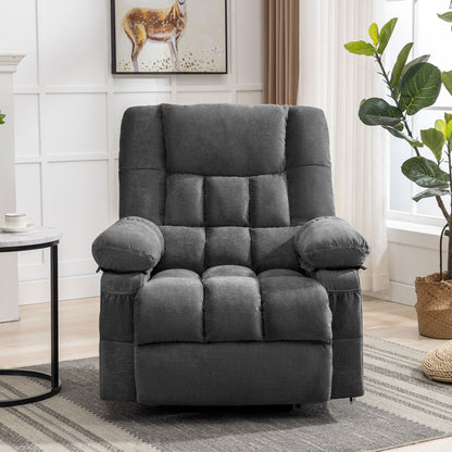 Gray recliner chair in a living room setting with a plant and side table.