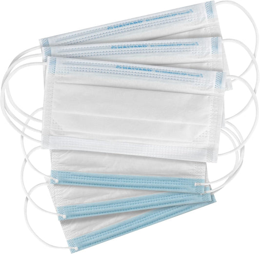Stack of white face masks with blue edges on a white background