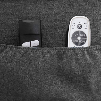 Black remote control and white electronic device in a pocket with a textured gray background