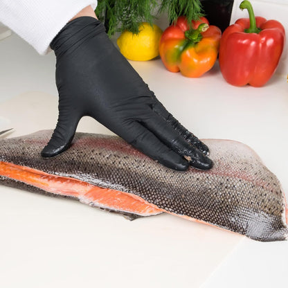 Hands wearing GMG black nitrile gloves. Ideal for medical exams, food prep, and cleaning tasks.