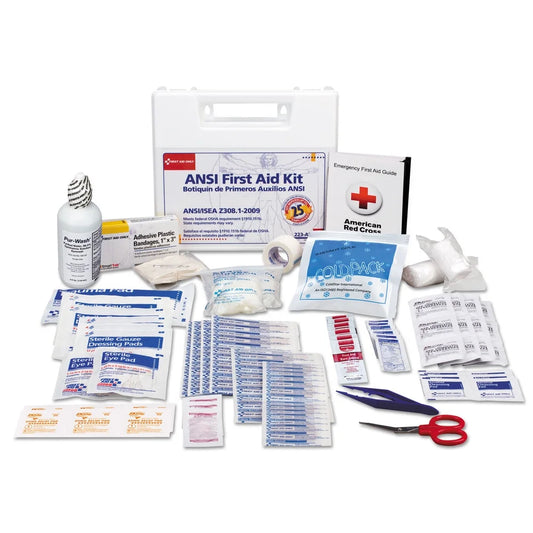 First aid kit with various supplies on a white background

