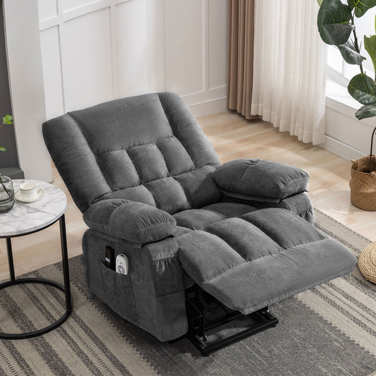 Gray recliner chair in a living room setting with a small table and plant.