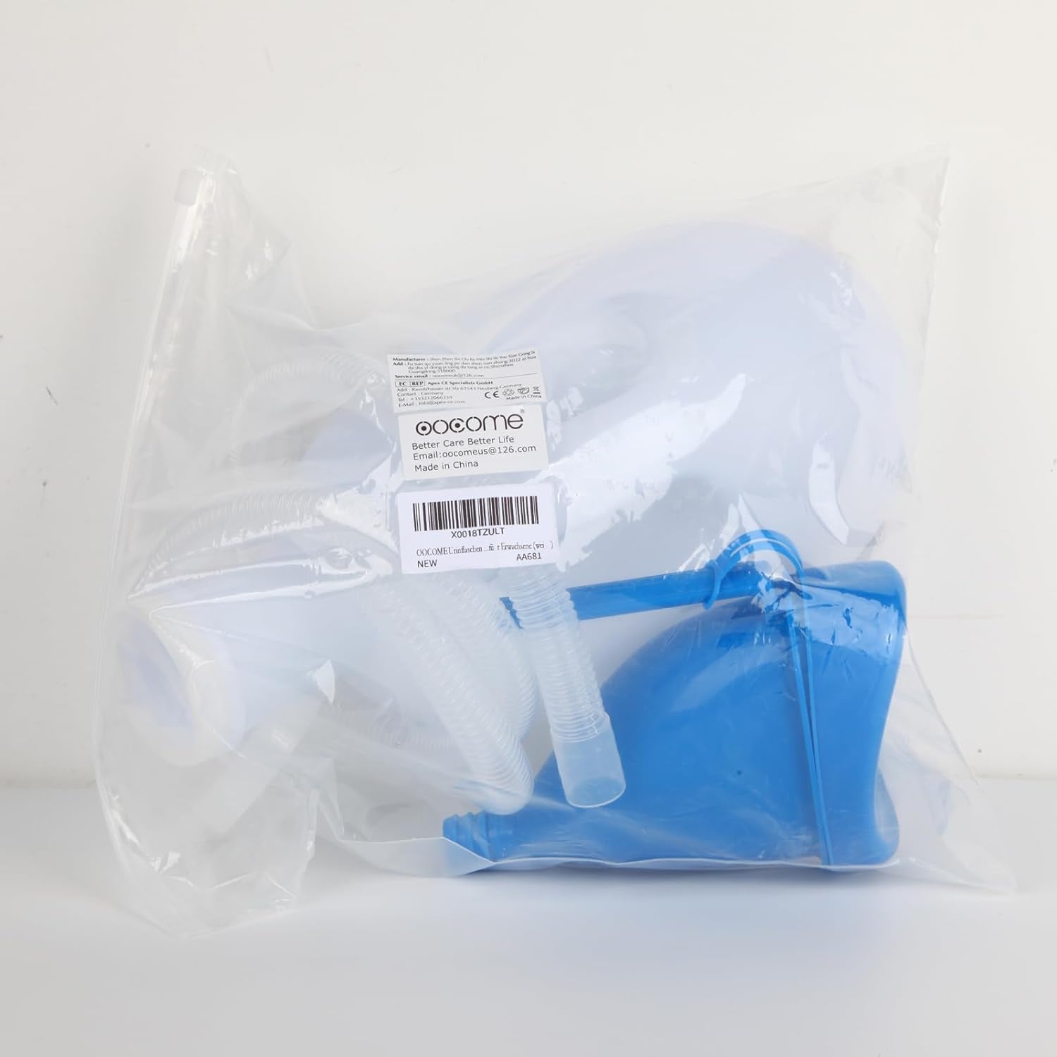 Blue plastic item in a clear plastic bag with a label on a white background

