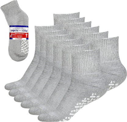 Set of gray diabetic socks with non-slip sole on a white background