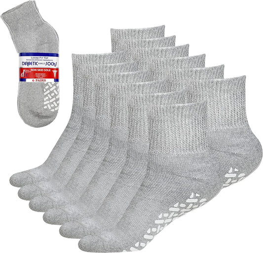 Set of gray diabetic socks with non-slip sole on a white background