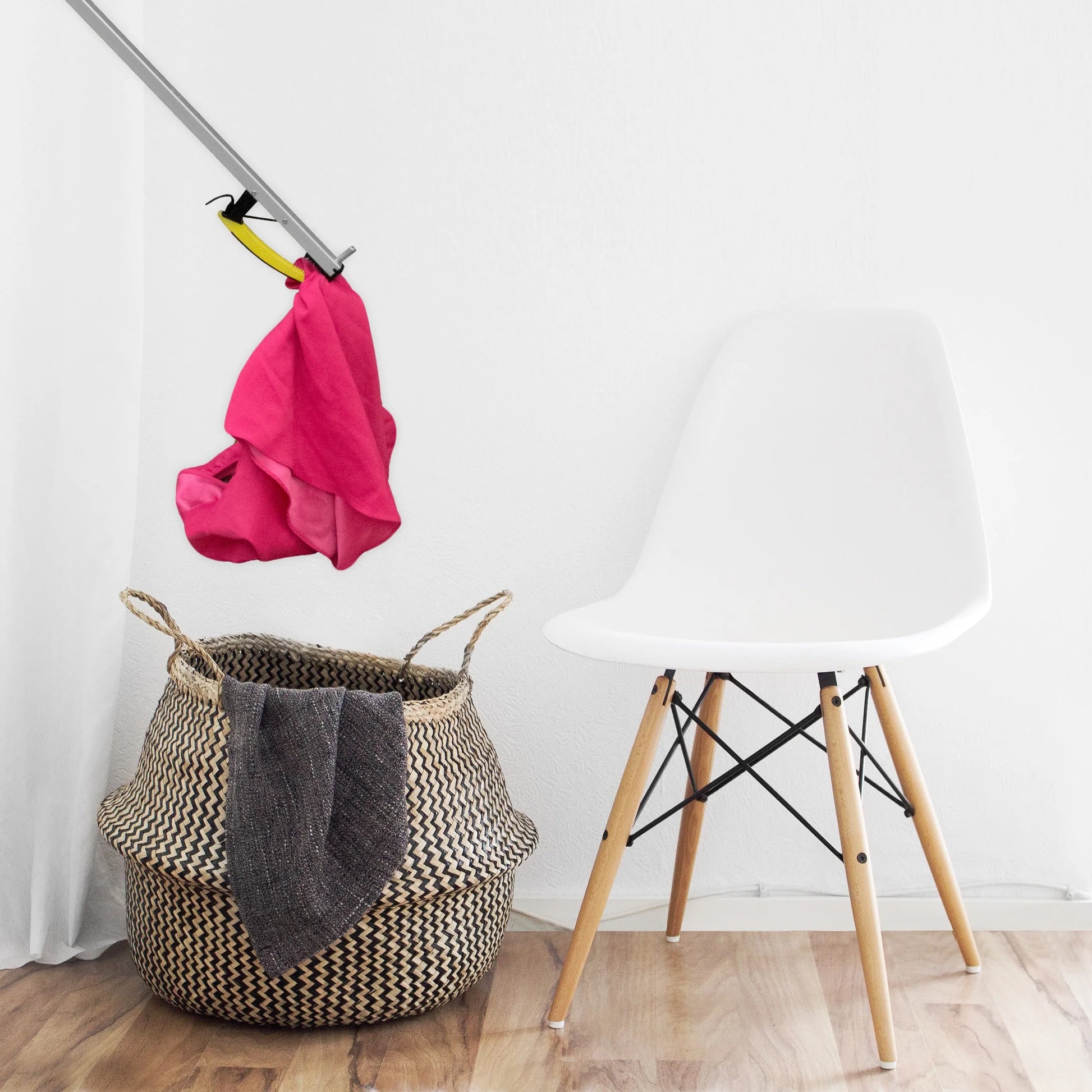 User reaching for items with Royal Medical 26-inch grabber tool. Ideal for seniors and limited mobility.