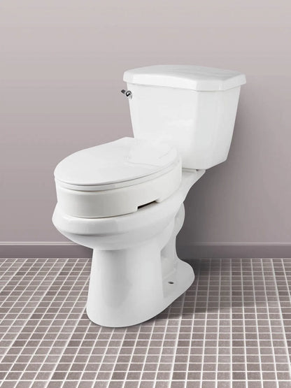 Carex Elongated Toilet Seat installed on standard toilet. Designed for seniors and recovery support.