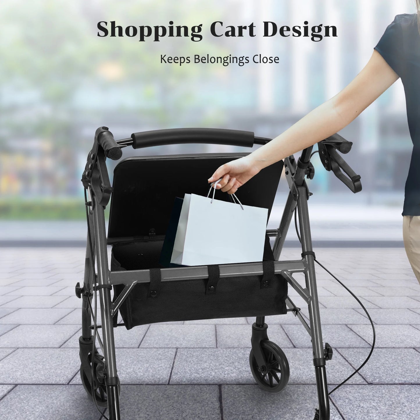 Person using a rollator with a bag attached, on a blurred street background.

