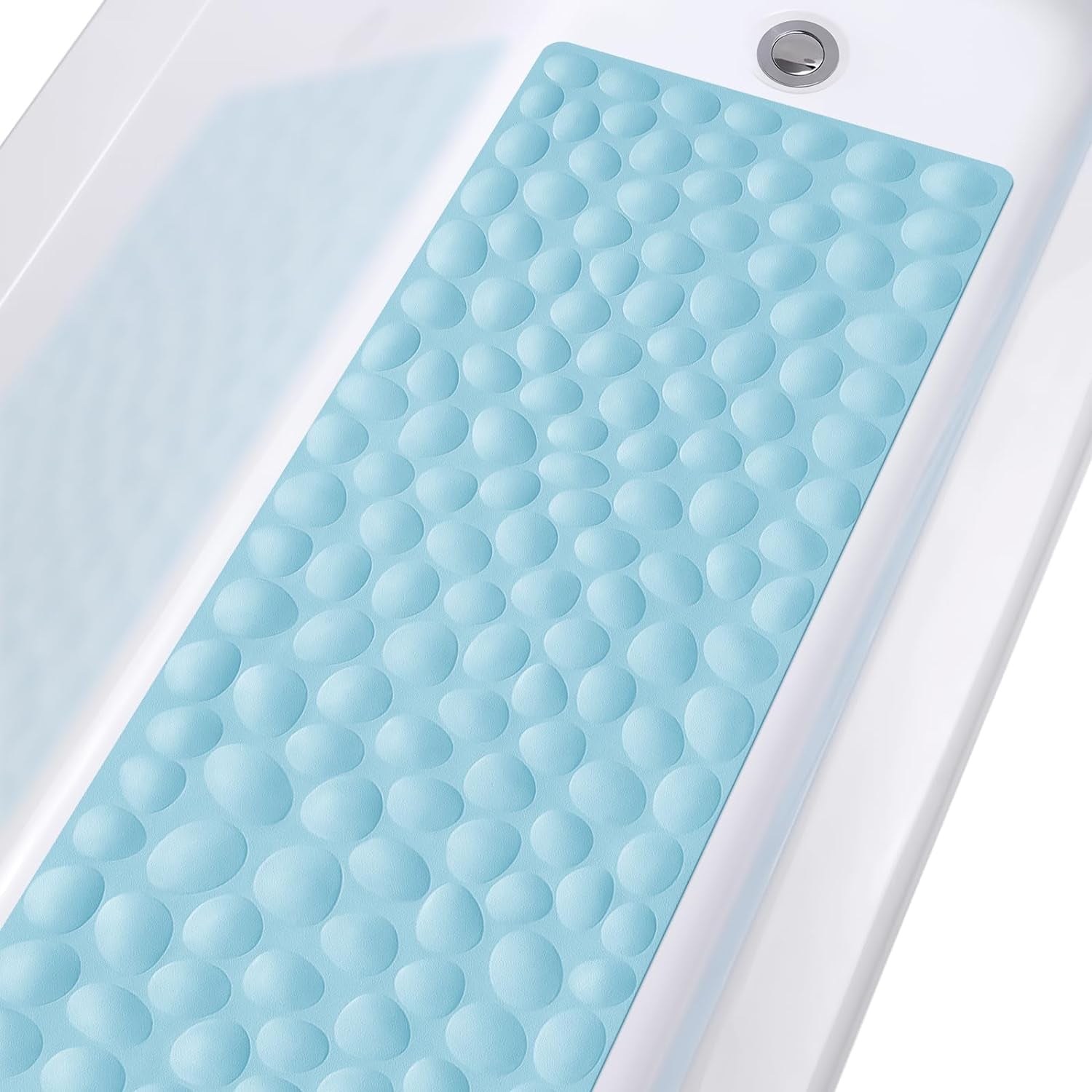 Blue bath mat with textured surface on a bathtub