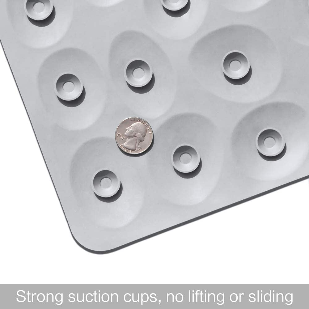 Transparent mat with suction cups and a coin for size reference on a white background