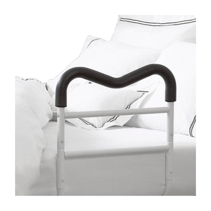 Bed rail with black handle on a bed with white bedding