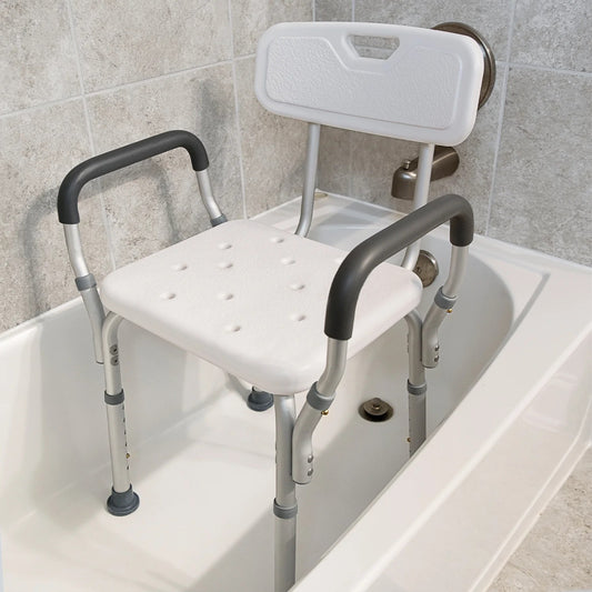 Shower chair with backrest and armrests inside a bathtub

